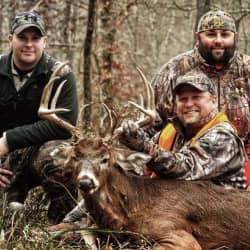 American Comrades co-founders with friend displaying deer